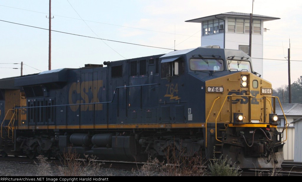 CSX 764 leads a southbound train at CO tower